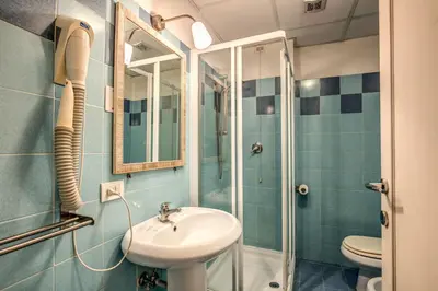 a bathroom with a sink and a shower at City Guest House in Rome