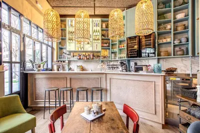 a restaurant with a wooden table and chairs at City Guest House in Rome