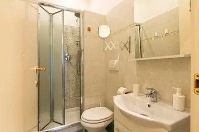 a bathroom with a shower and a toilet and a sink at Giulio Cesare Imperatore in Rome