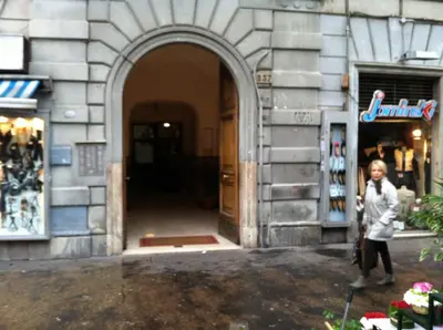 a woman standing in front of a building at Giulio Cesare Imperatore in Rome