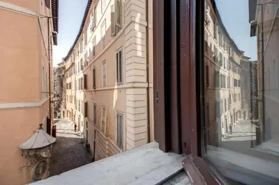 a view of an alley from a window at Nova Domizia in Rome