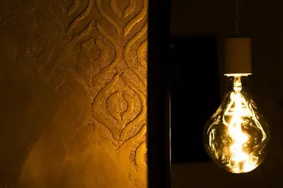 a glass bottle with a light on a wall at Dulcis In Pantheon in Rome