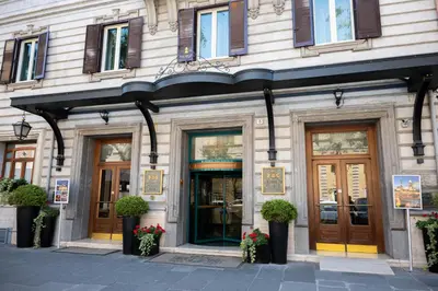 a facade of a building with doors and windows at Hotel Mecenate Palace in Rome