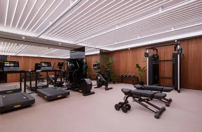 a gym with several exercise equipment in a room at art'otel Rome Piazza Sallustio in Rome