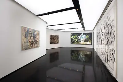 a room with paintings on the walls of a museum at art'otel Rome Piazza Sallustio in Rome