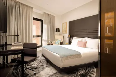 a hotel room with a bed and a desk at art'otel Rome Piazza Sallustio in Rome