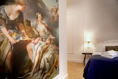 a bedroom with a painting on the wall at Hotel Silva in Rome