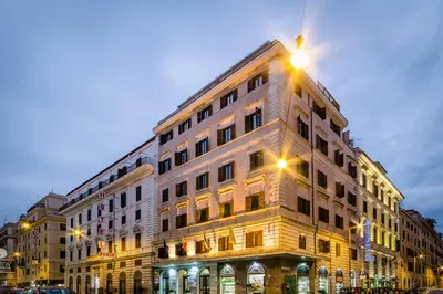 a building with a street light on top of it at Exe Domus Aurea in Rome