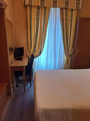 a bathroom with a shower and a toilet and a sink at Hotel dei Quiriti in Rome