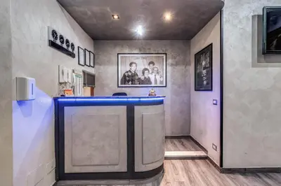 a bar in a room with a blue counter at Hotel Planet in Rome