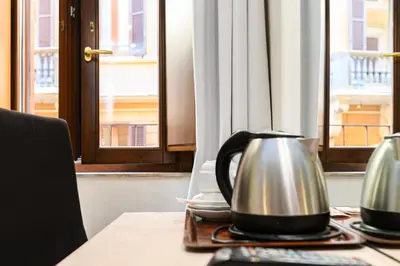 a table with a tea kettle on top of it at Hotel Julia Trevi - Spagna in Rome