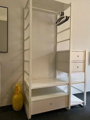 a white closet with white shelves at Guest House Rome by GHOR in Rome