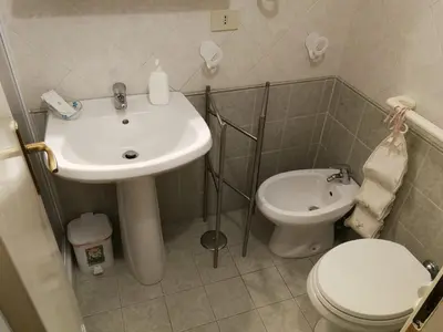 a bathroom with a sink and a toilet at Casa Zavatti in Rome