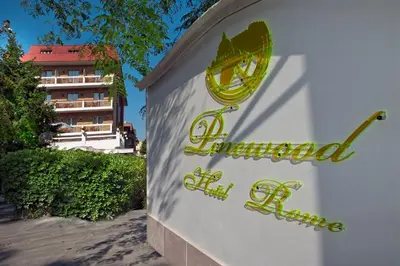 a sign for a hotel in front of a building at Pinewood Hotel Rome in Rome
