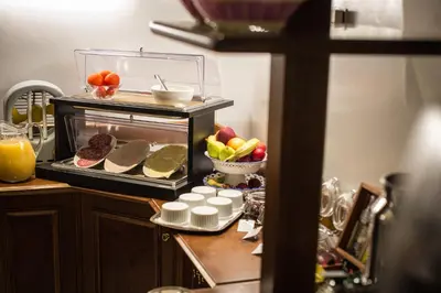 a kitchen with a counter with food in an oven at Hotel Grifo in Rome