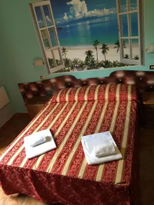 a bed with two napkins on top of it at Hotel Gabriele in Rome