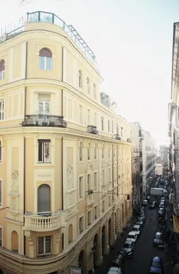 a large yellow building on a city street at Hotel Cellini in Rome