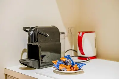 a counter with a toaster and a plate of chips at Palazzo Donarelli in Rome