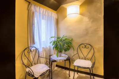 a small bedroom with a bed and a window at Hotel Fontana in Rome