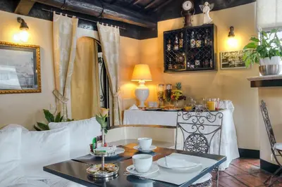 a hotel room with two beds and a television at Hotel Fontana in Rome