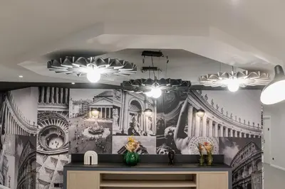 a room with a wall with a painting on it at Belstay Roma Aurelia in Rome