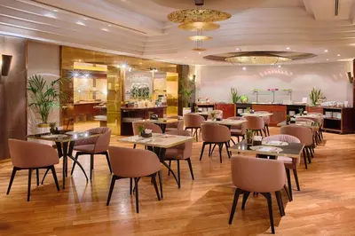 a restaurant with tables and chairs in a room at NH Roma Villa Carpegna in Rome