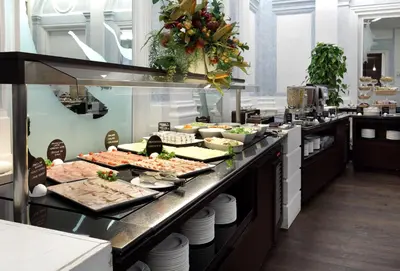 a buffet line with many different types of food at Exe International Palace in Rome
