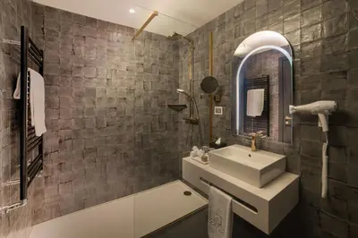 a bathroom with a sink and a mirror at nhow Roma in Rome