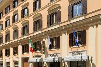 a building with flags on the side of it at Marcella Royal Hotel - Rooftop Garden in Rome
