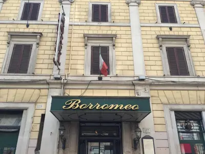 a building with a sign for a store at Hotel Borromeo in Rome