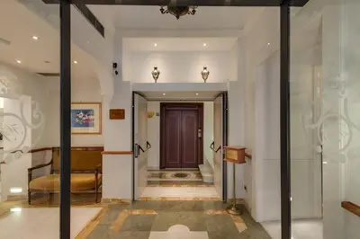 a hallway with a door leading to a room at Hotel Borromeo in Rome