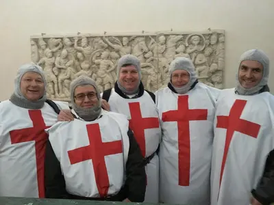 a group of four men dressed up in crosses at Hotel Orlanda in Rome