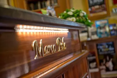 a sign on a counter in a store at Hotel Marco Polo Rome in Rome