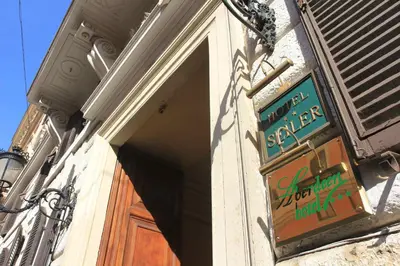 a sign on the side of a door of a store at Hotel Seiler in Rome