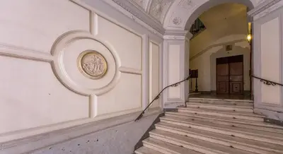 an empty hallway of a building with a staircase at 939 Hotel in Rome