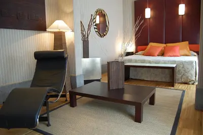 a bedroom with a bed and a table and a chair at Hotel Morgana in Rome