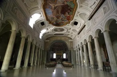 a large room with a ceiling with paintings on it at Vesta Domus in Rome