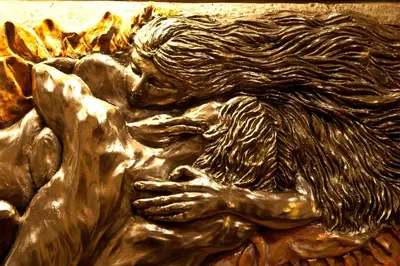 a bronze statue of a man with long hair at Hotel Forte in Rome