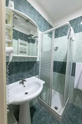 a bathroom with a sink and a shower at Hotel Anfiteatro Flavio in Rome