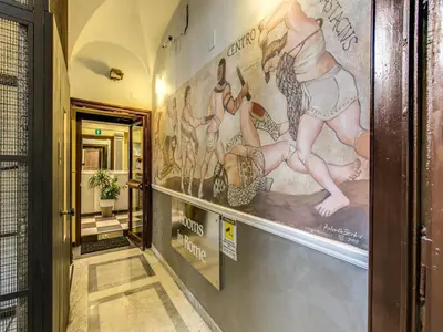 a hallway with a mural on the wall at Hotel Centro Cavour Roma in Rome