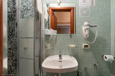 a bathroom with a sink and a shower at Hotel Centro Cavour Roma in Rome
