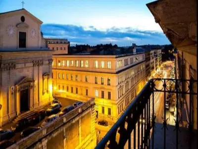 a view of a city at night from a balcony at Hotel Centro Cavour Roma in Rome