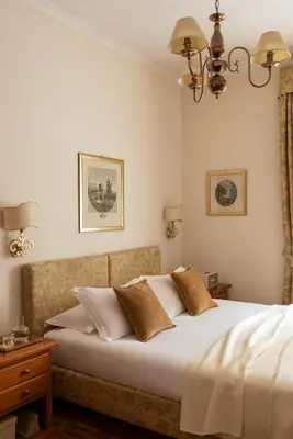 a hotel room with a bed and chairs at Hotel Cortina in Rome