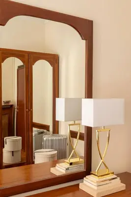 a white bathroom with a sink and a toilet at Hotel Cortina in Rome
