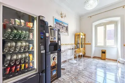 a room with a large refrigerator with food inside at Hotel Virginia in Rome