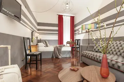 a living room with a couch and a table at All'Orologio in Rome
