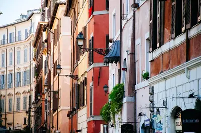 a group of buildings in a city street at All'Orologio in Rome
