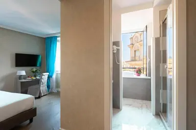 a view of a hotel room with a bed and a window at Atlante Star Hotel in Rome