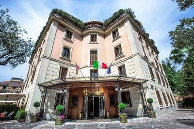 a building with two flags on top of it at Grand Hotel Gianicolo in Rome