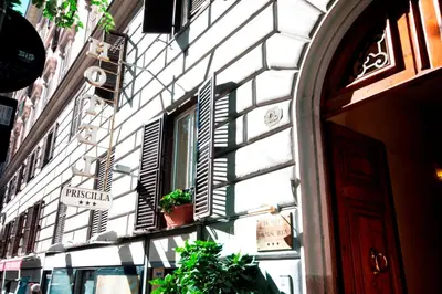 a building with a window with plants on it at Hotel Priscilla in Rome